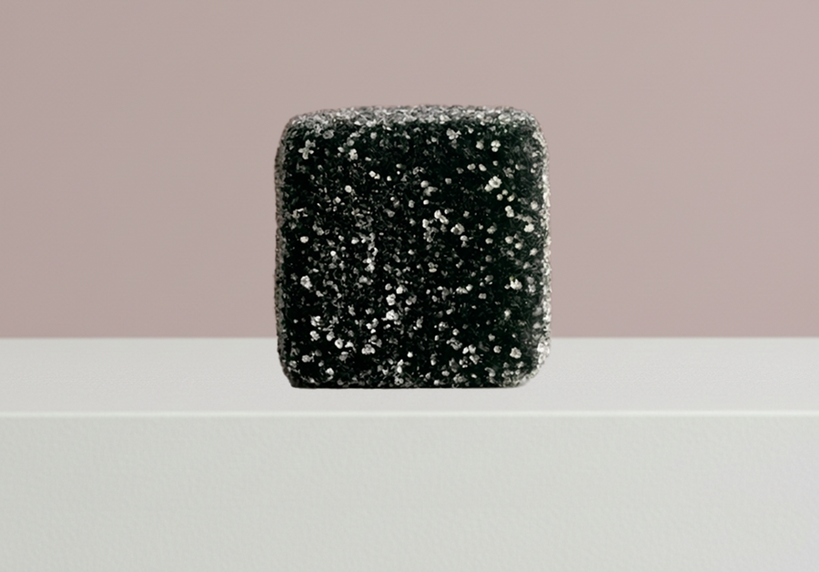 Close-up of a dark, opaque Happy Soul gummy